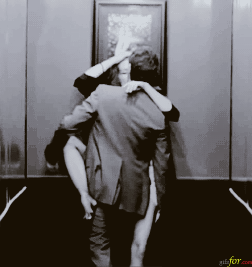 Security camera in the elevator... clothed amateur  gif